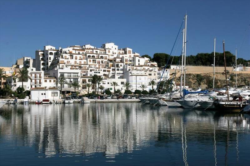 Yacht marina and whitewashed houses in Moraira, Costa Blanca.