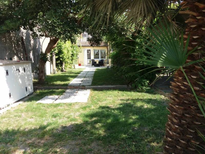 Garden lawn at Giardino holiday apartment, Murano Island.