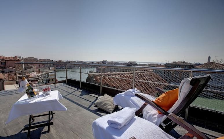 Roof deck terrace at Murano Suites in the Venetian lagoon, Italy.