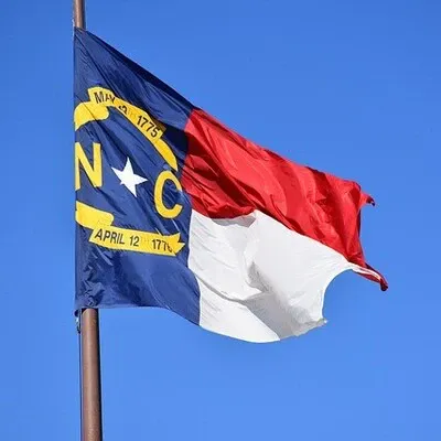 North Carolina flag in blue, red, white and gold.