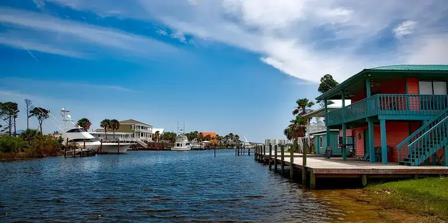 Typical watertfront houses and luxury yachts at Orange Beach.