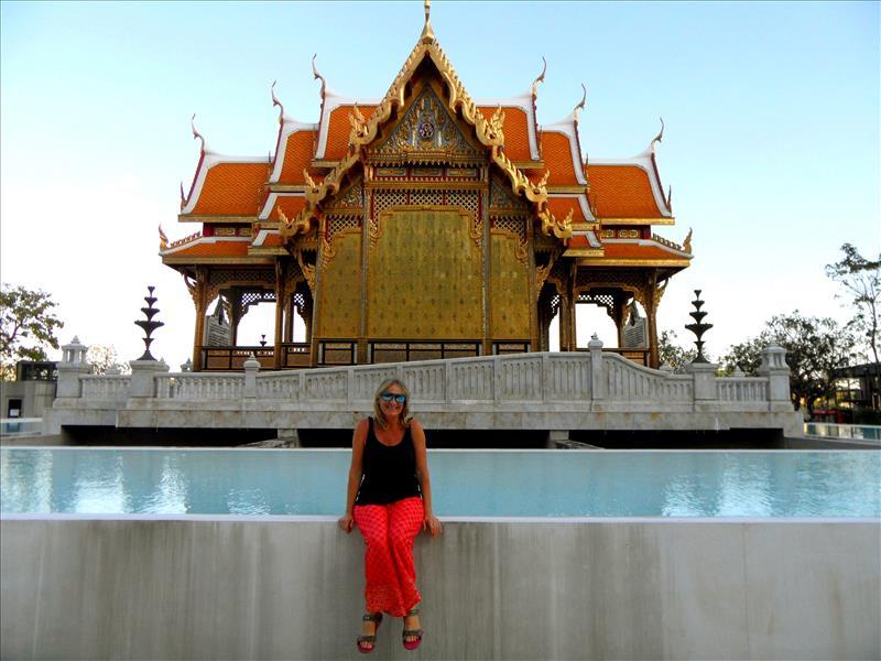 Me (Kali) sitting in front of a pagoda in theThonburi district of Bangkok in Thailand.