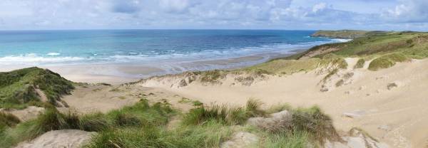 Sand dunes to the sea at Perranporth, visit Cornwall this summer.