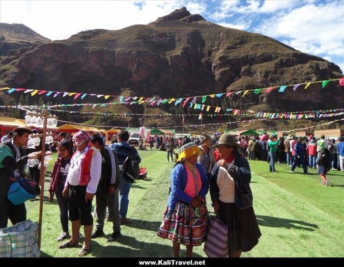 People in traditional Peruvian dress at Pisac Agriculture Fair in the Sacred Valley.