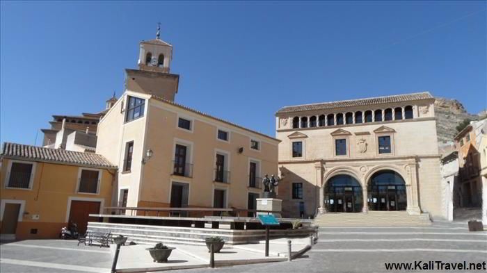 Jumilla's town hall square surrounded by medieval buildings.