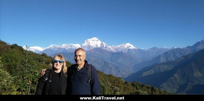 Poon Hill summit at dawn with the Annapurna peaks in the distance, Nepal.