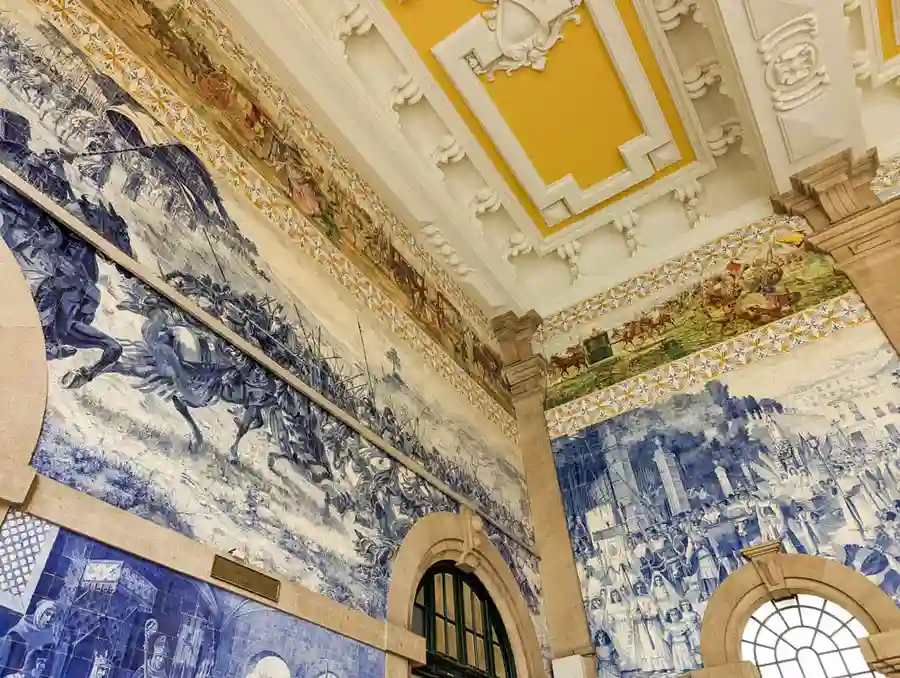 Murals and ceiling in Sao Bento train station in Porto.