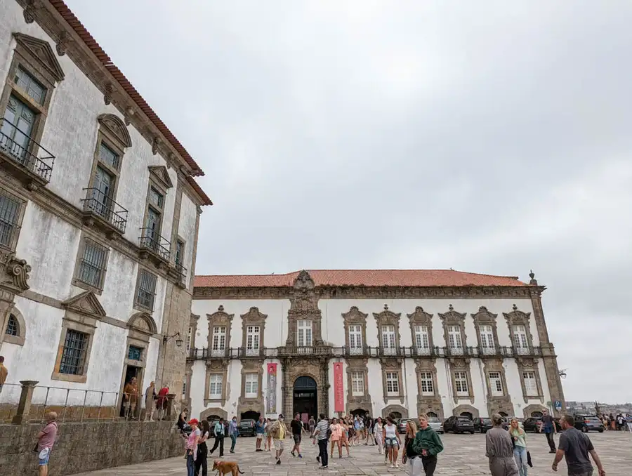 People in the square in front of the historical Bishop’s Palace in Porto.