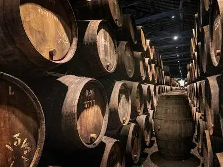 Barrels of port in a wine cellar in Porto