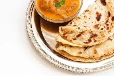 Dish of roti canai with Indian flat bread.