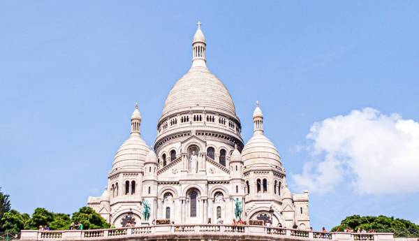 White domes of Sacre Coeur Cathedral in Paris on a day trip from London.
