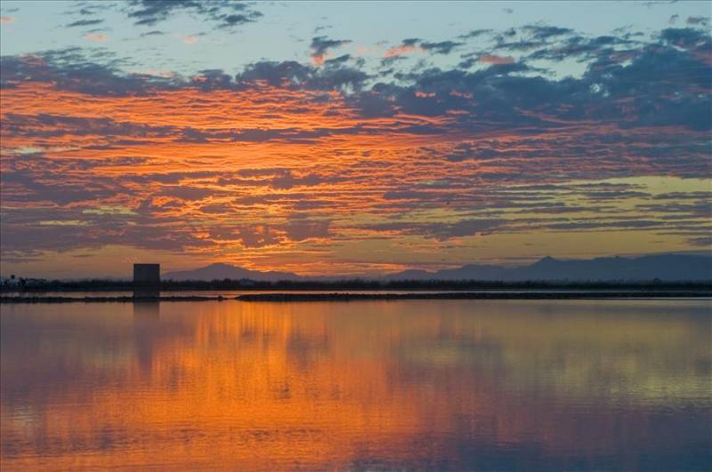 Sunset over Santa Pola salt lakes in Costa Blanca, Spain.