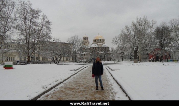 Standing in the snow beside St Alexander Nevski Square in Sofia, Bulgaria