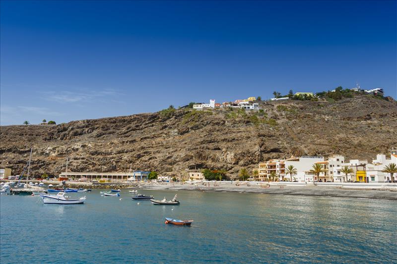 Boats off Puerto Santiago beach in La Gomera, Canary Isles.