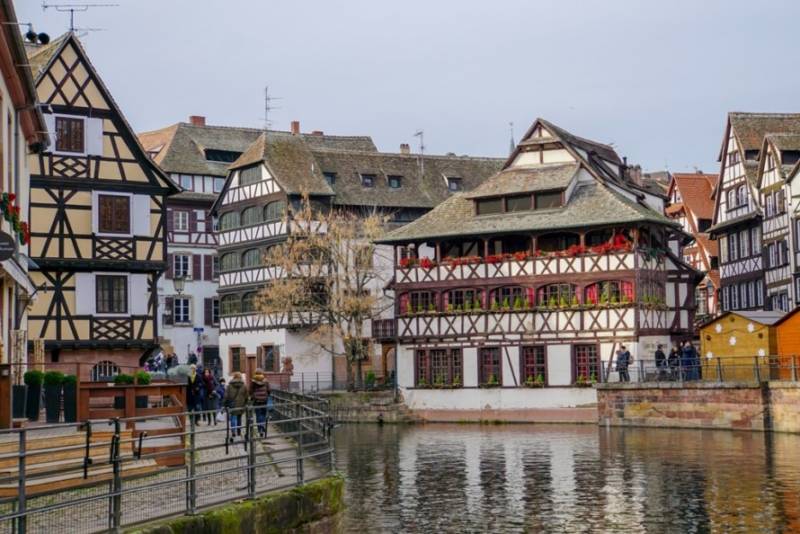 Typical wooden window houses by the river in Strasbourg.