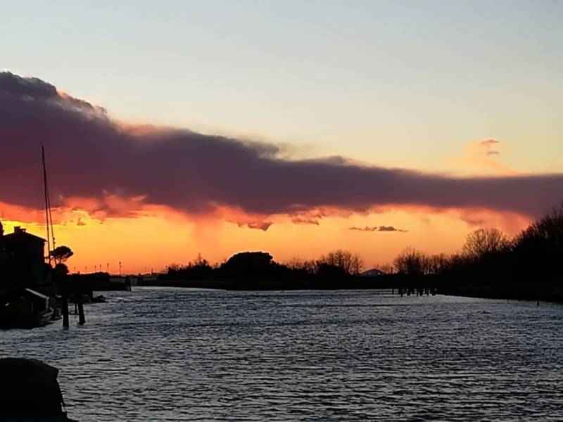 Sunset over Venice Lagoon from Cà Luciotti cottage on Mazzorbo Island, Italy.