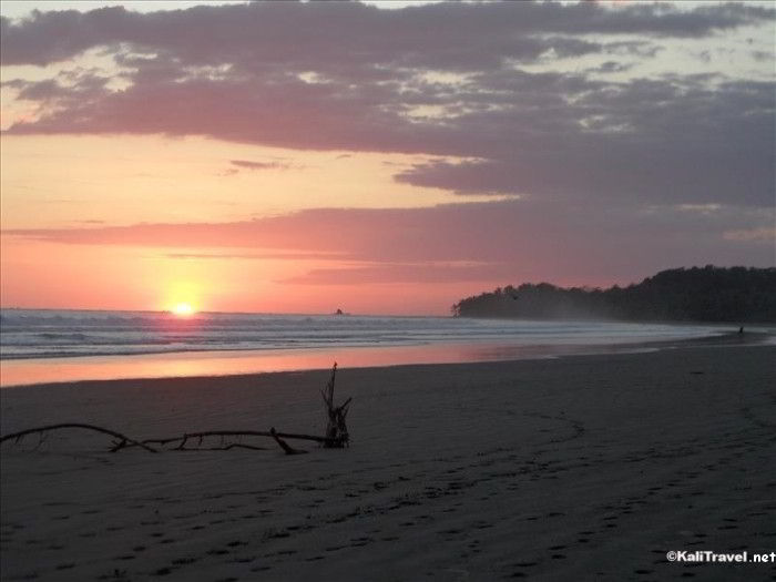 Sunset over the Pacific Ocean at Marino Ballena Marine Reserve in Costa Rica.