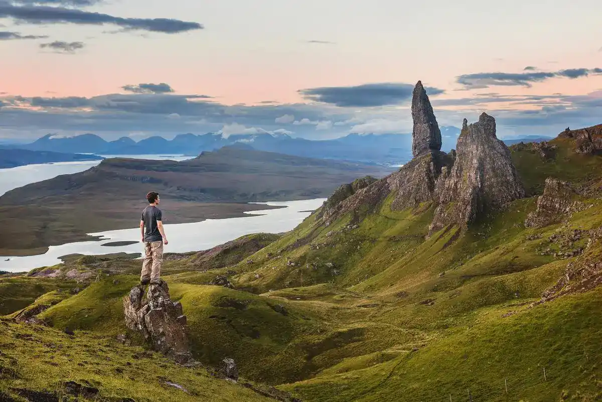 Eco-friendly traveller looking over the beautiful landscape of Scotland.