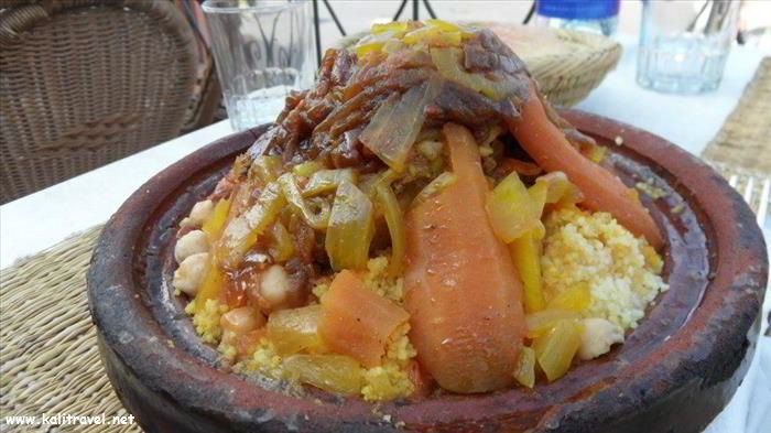 Lamb and couscous Tajine in the traditional earthenware pot.