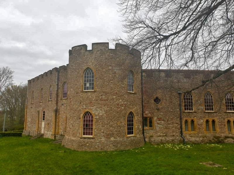 Round tower and façade of Taunton Castle in Somerset.