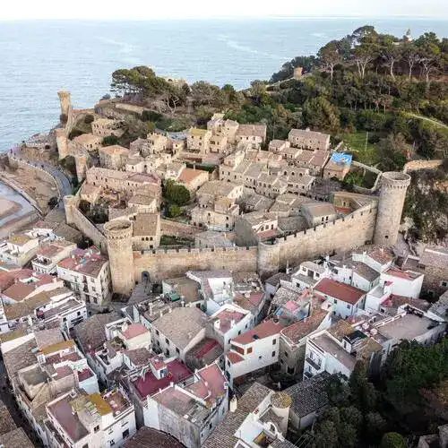 Walled medieval town on the Costa Brava coastline.