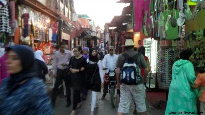 Tourists and locals in the main souk of Marrakesh.