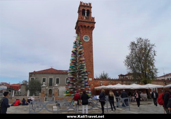 Colorful glass tree beside the clocktower in Campo San Stefano on Murano Island, Venice