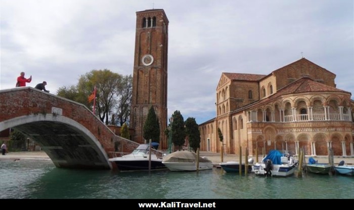 Murano Cathedral and bell tower beside San Donato canal, Venetian Lagoon.