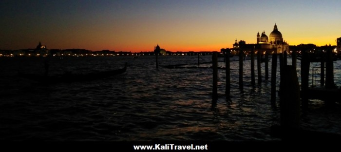 Orange sunset over Venice skyline and lagoon