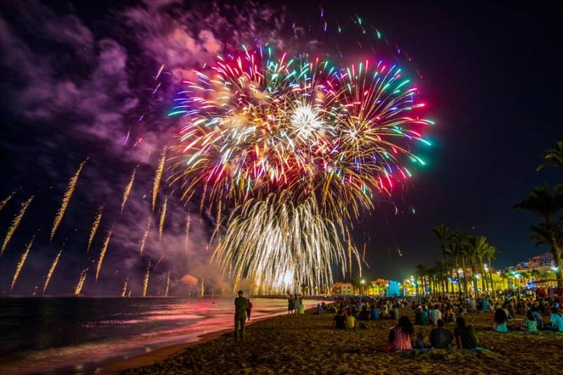 Colourful fireworks seen from Villajoyosa beach in Costa Blanca, Spain.
