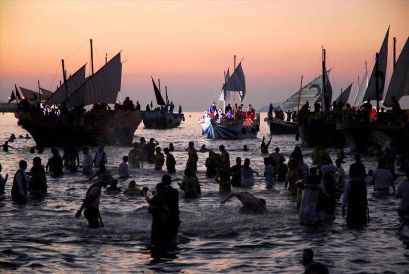 Sail boats at 'dawn battle and sea landing, Moors and Christians fiesta in Villajoyosa.