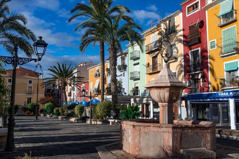 Colouful façades of seafront restaurants in Villajoyosa, Costa Blanca.