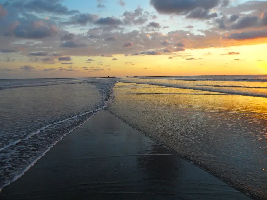 Sunset at Marino Ballena as the waves part at Mose's Way in Costa Rica.