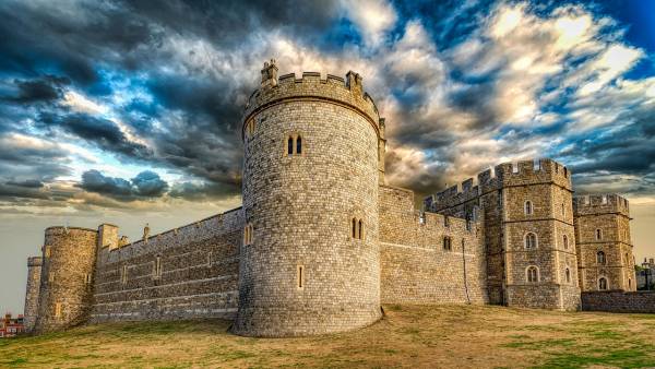 The stone towers of Windsor Castle are a day trip from London.